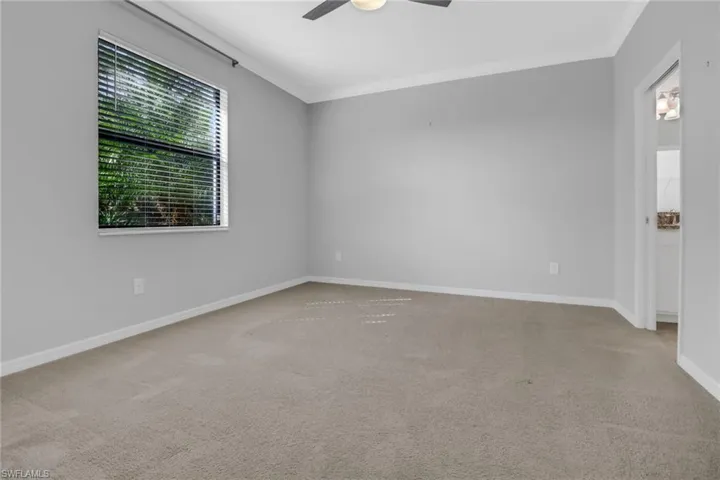 ornamental molding, baseboards, and ceiling fan