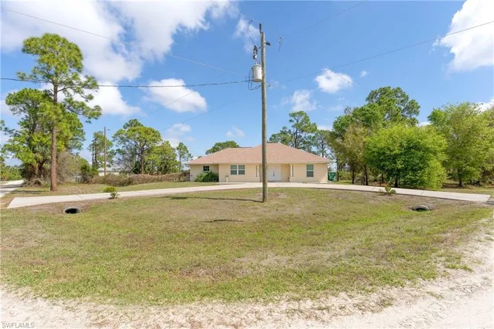 View of front of home with curved driveway