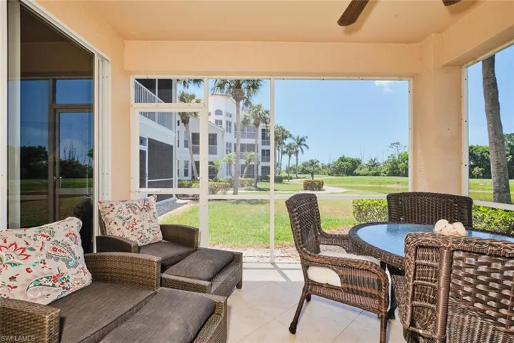 Sunroom / solarium featuring a ceiling fan