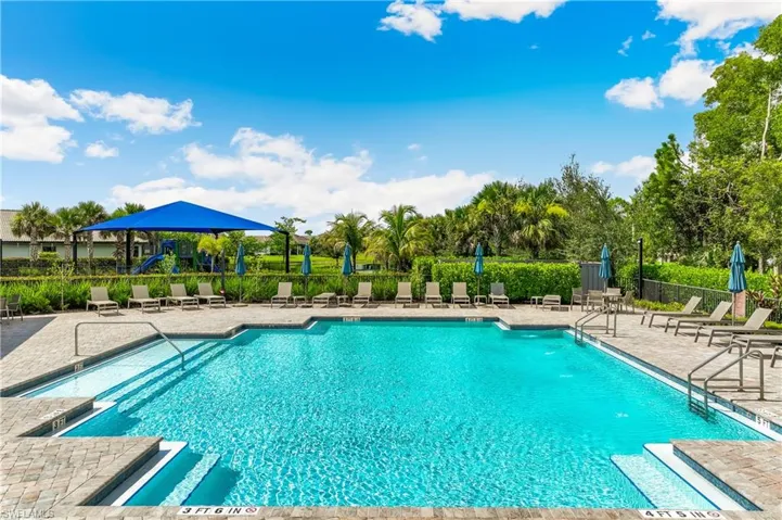 Community pool with a patio area