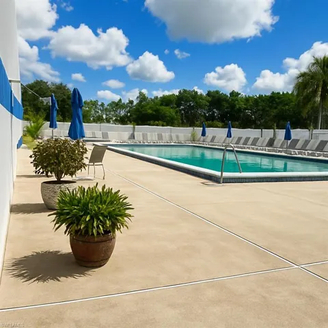 Community pool with a patio area