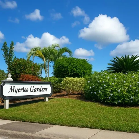 Community / neighborhood sign with a lawn