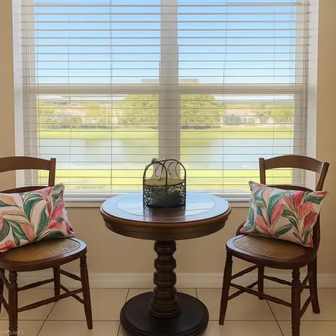 Sitting room featuring healthy amount of natural light and light tile patterned floors