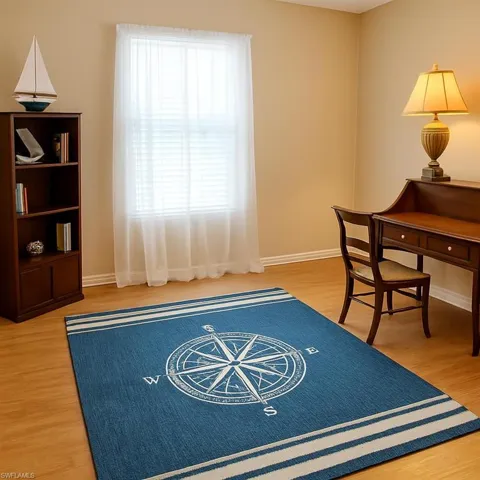 Office space with light wood finished floors and baseboards
