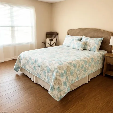 Bedroom with wood finished floors