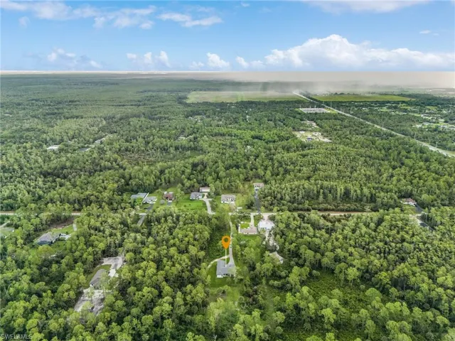 View of property location with a forest