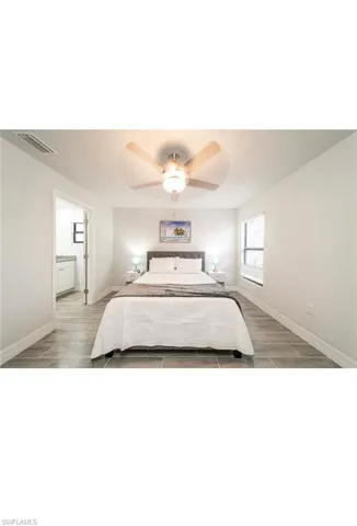 Bedroom featuring ceiling fan and light wood-type flooring