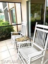 screened back porch/lanai of Living Room (Steps to Pool)