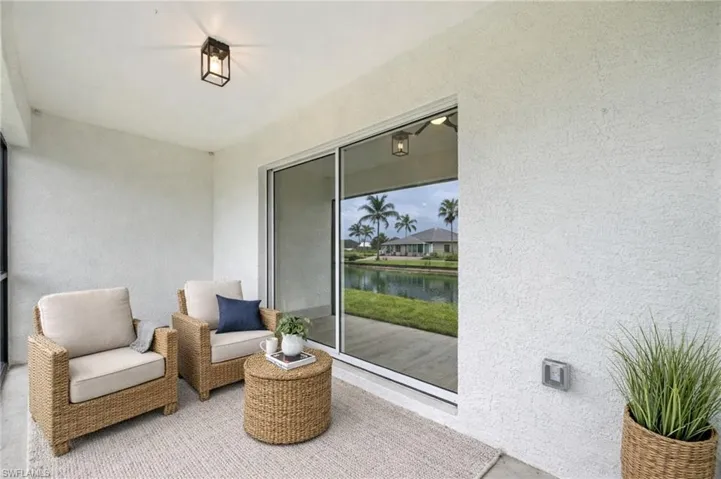 Sunroom with a water view