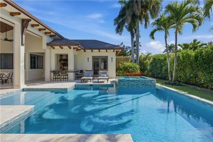 Scenic South-Facing Pool Framed by Palms