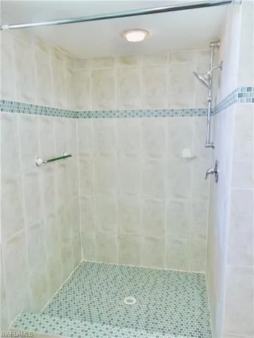 Primary Bathroom with a shower stall