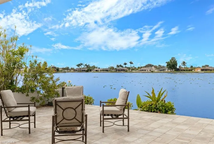 View of patio with a water view