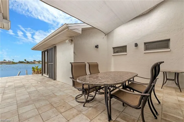View of patio / terrace with a water view and outdoor dining space