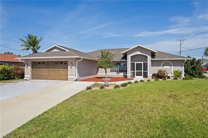 Ranch-style home with stucco siding, a garage, concrete driveway, and roof with shingles