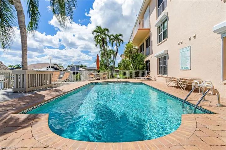 Community pool featuring a patio area