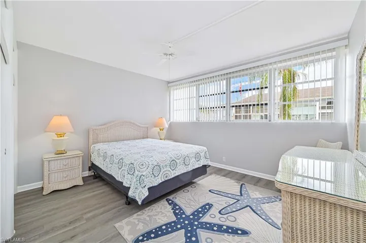 Bedroom with wood finished floors and a ceiling fan