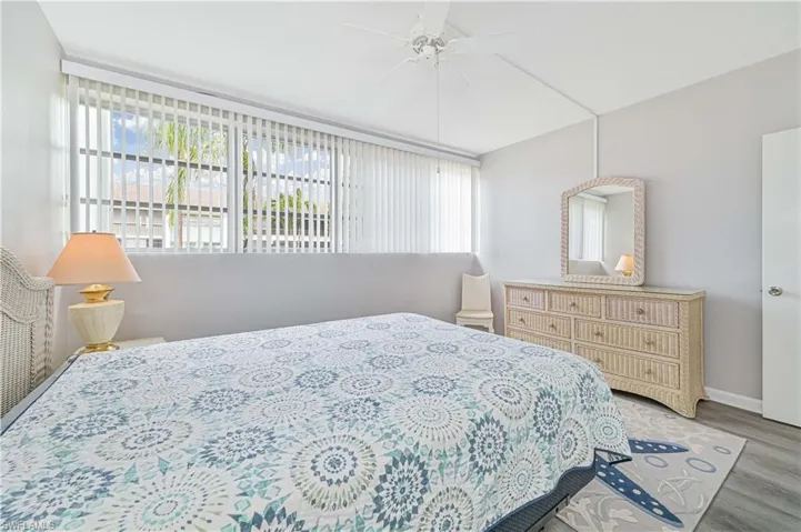 Bedroom featuring two closets and ceiling fan