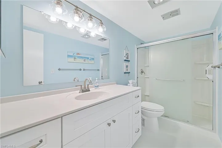 Bedroom featuring light wood-style flooring and baseboards