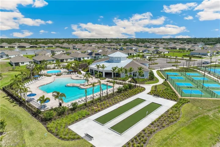 Aerial view of residential area featuring a pool