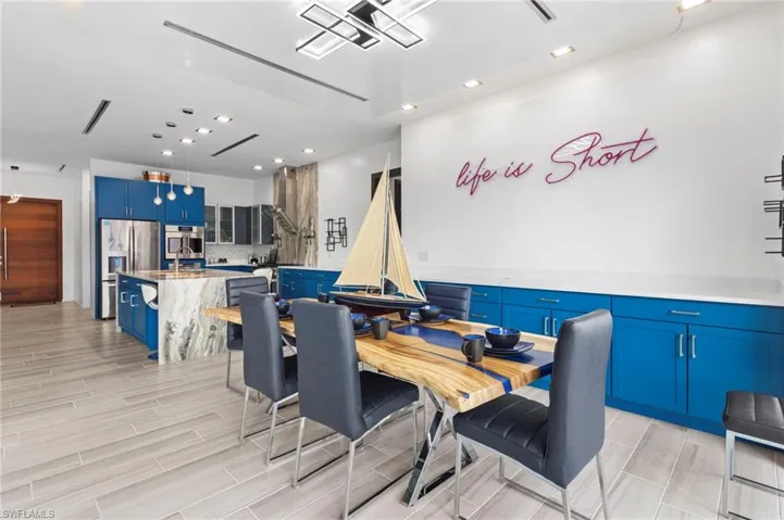 Dining area with light hardwood / wood-style flooring and sink