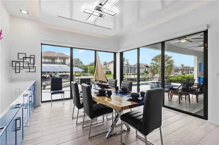 Dining area featuring ceiling fan, light hardwood / wood-style floors, and a wealth of natural light