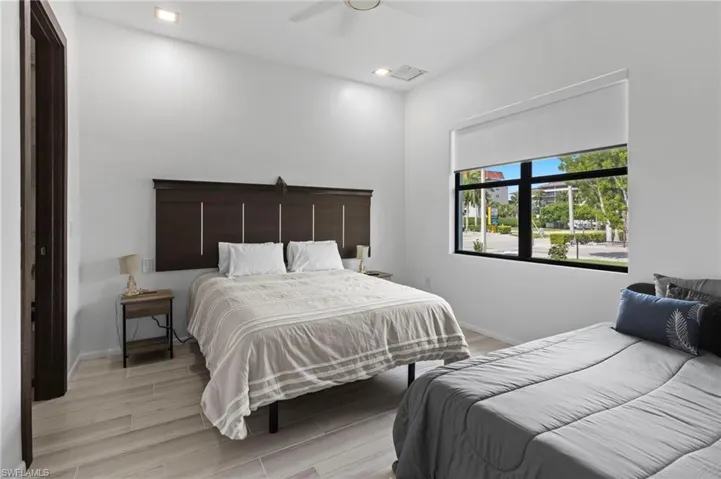Bedroom with light wood-type flooring and ceiling fan