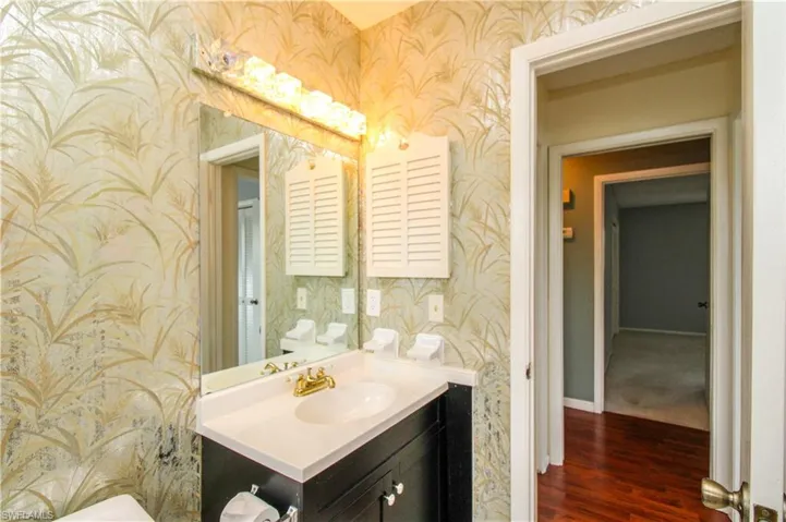 Bathroom with vanity and wood-type flooring