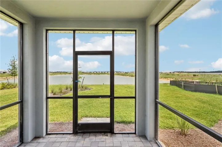 Unfurnished sunroom with a water view and plenty of natural light