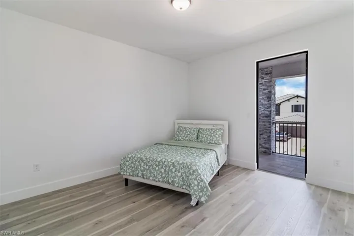 Bedroom 2 w/ access to balcony