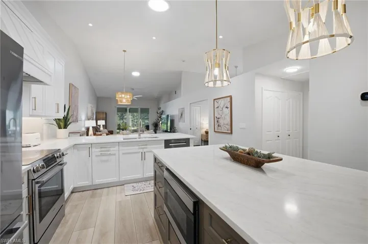 Renovated kitchen with quartz countertops.