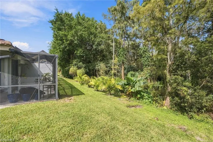 Serene landscaped views and mature trees in preserve
