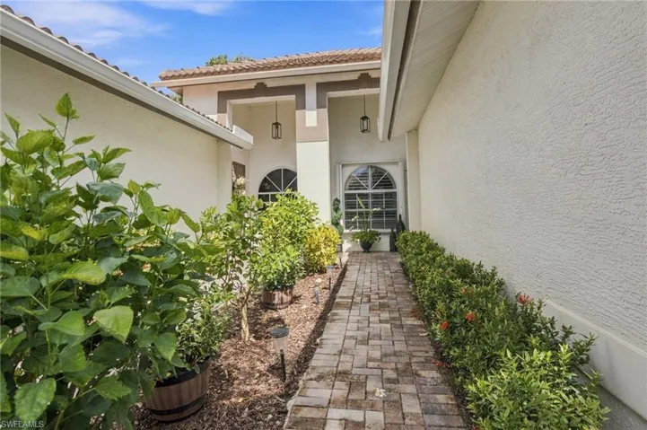 Charming landscaped walkway to front entry.