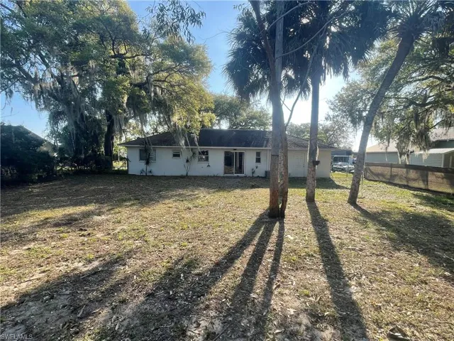 Back of property featuring stucco siding