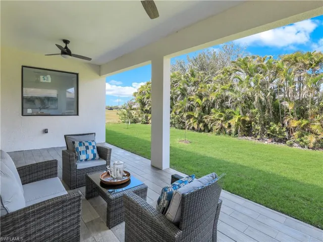 View of patio / terrace with ceiling fan and an outdoor hangout area