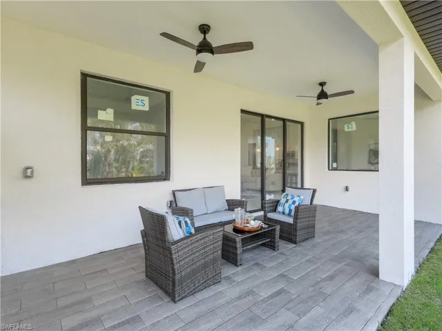 View of patio featuring a ceiling fan and outdoor lounge area