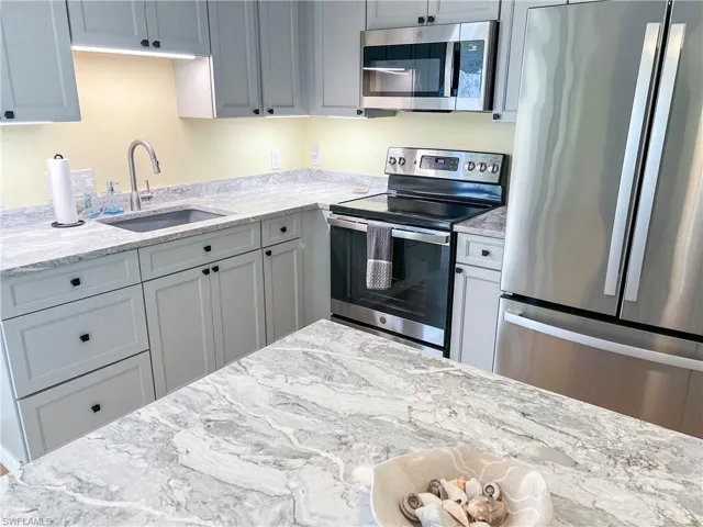 Kitchen with quartz counters and high end stainless appliances