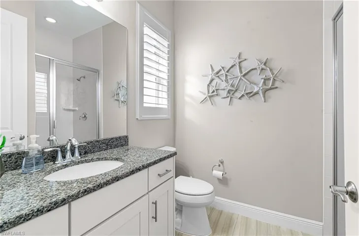 GUEST ENSUITE BATHROOM WITH TILED GLASS SHOWER, GRANITE COUNTERTOP & SOFT-CLOSE DRAWERS!