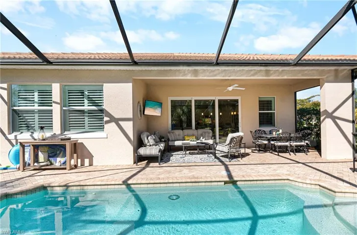 NOTE THE 3 IMPACT RESISTANT SLIDER DOORS TO ENTER YOUR POOL AREA FROM INSIDE THE HOME!