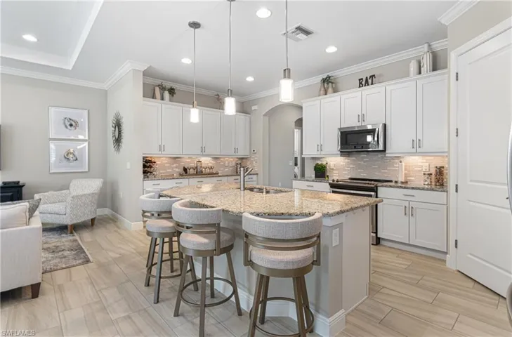 AMAZING KITCHEN WITH MORE CABINETS THAN ANY OTHER MODEL HOME IN PELICAN PRESERVE WITH SOFT-CLOSE DRAWERS & A ONE-LEVEL COUNTERTOP PLUS UNDER MOUNT LIGHTING!