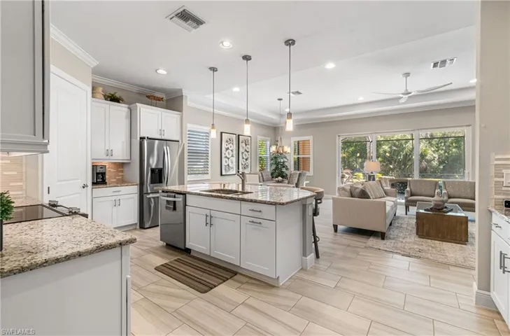 TOTALLY OPEN FLOOR PLAN WITH AMAZING TILE FLOORING, CROWN MOLDING & UNDER MOUNT LIGHTING!