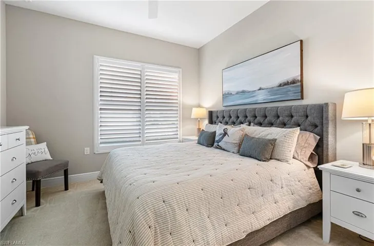 FRONT GUEST BEDROOM WITH A KING-SIZED BED, PLANTATION SHUTTERS & FULLY FURNISHED FOR YOUR GUESTS TO ENJOY!