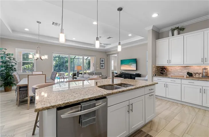 VOLUME CEILING, CROWN MOLDING, PLANTATION SHUTTERS & UPDATED FLOORING IN A TOTALLY OPEN CONCEPT!