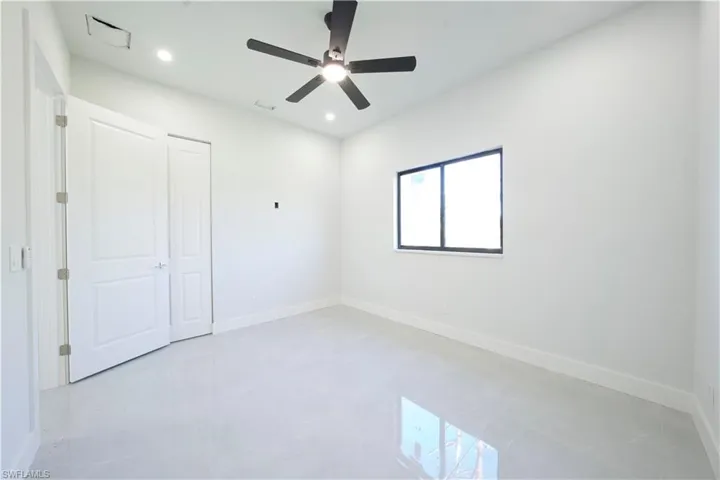 Unfurnished bedroom with a ceiling fan and recessed lighting