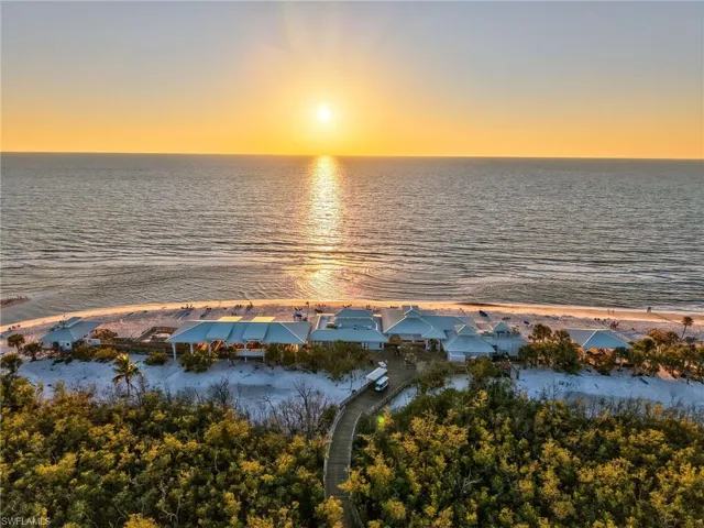 Aerial Sunset View of Pelican Bay Private Beach and Beach Club