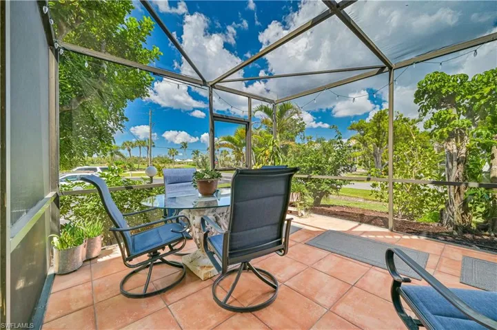 View of patio / terrace featuring glass enclosure and outdoor dining space
