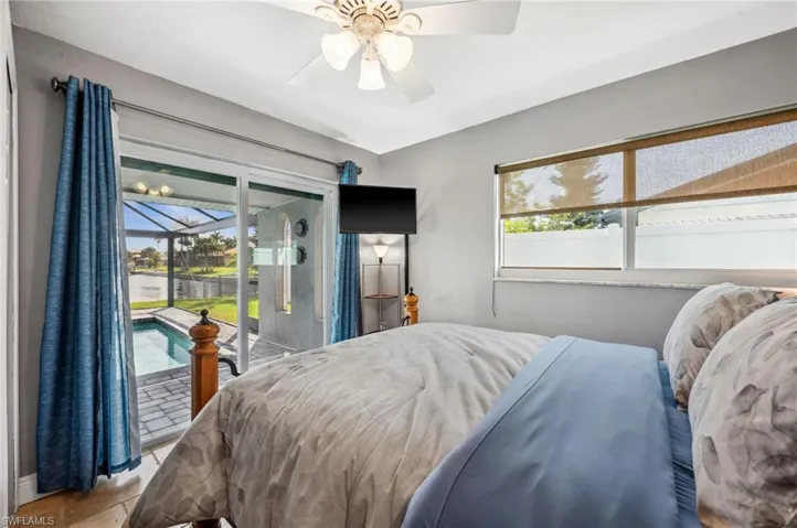 Second Bedroom with patio door to the pool