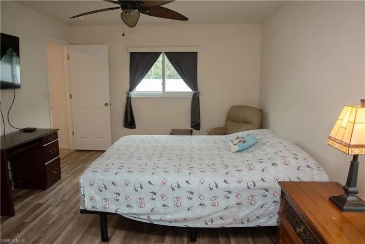 Full bath with vanity, light tile patterned flooring, and shower / bathtub combination with curtain