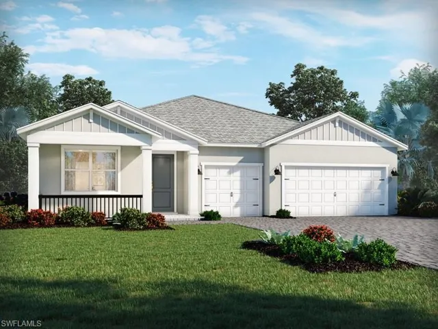 Ranch-style home featuring a front yard, a garage, and covered porch