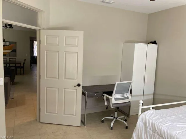 This room features light-colored walls and tiled flooring
