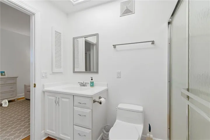 Full bathroom featuring vanity and toilet